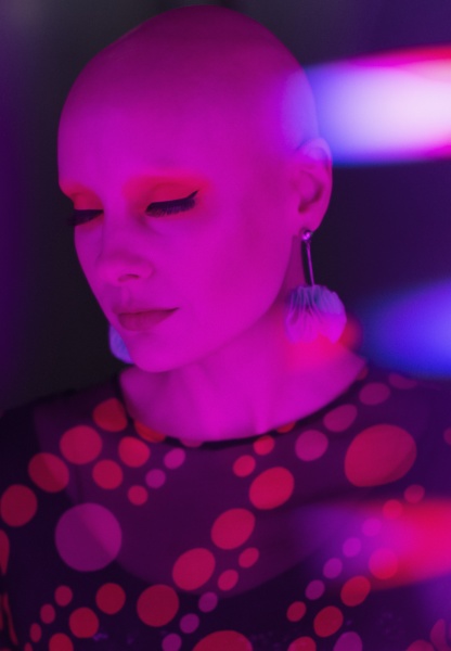 stylish serene woman with shaved head