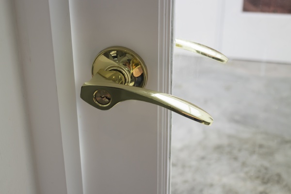 golden handles on a glass door