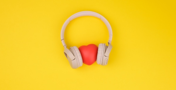 red heart and beige wireless headphones