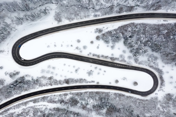 winter snow winding road serpentine switchbacks