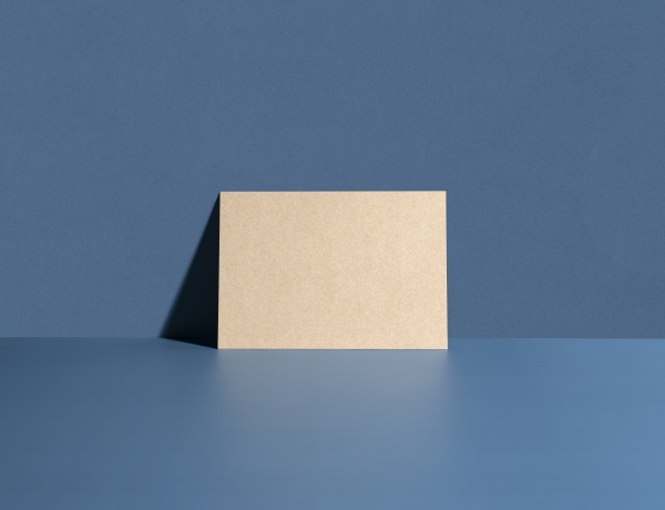 brown card leaning against a blue