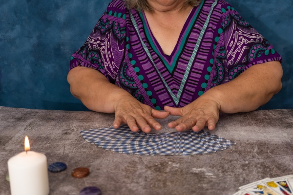 woman casting tarot cards