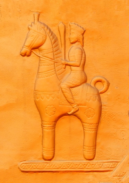 wall art of man riding horse