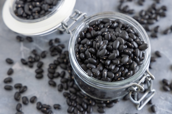 glass jar with dry black beans