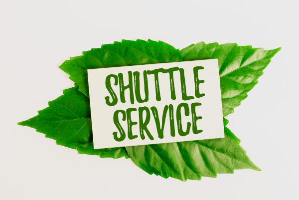 sign displaying shuttle service business