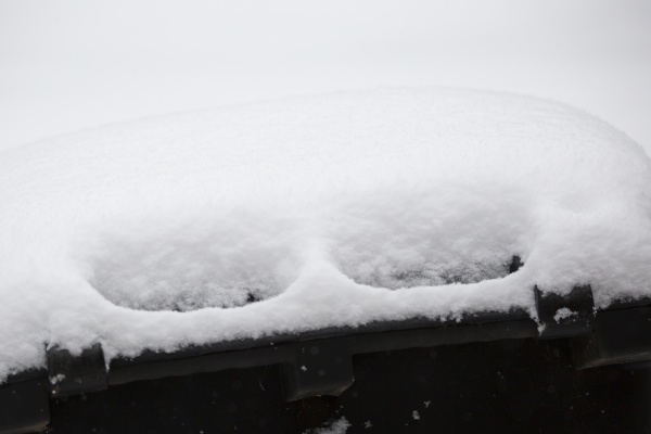 snow on a garbage can