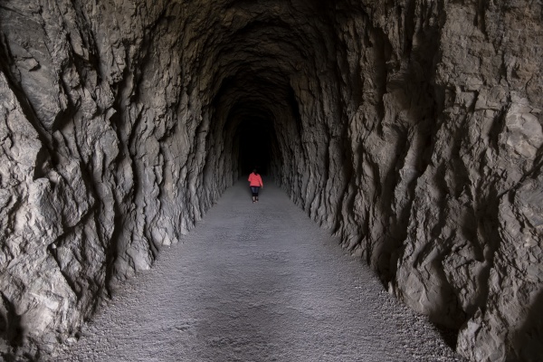 woman in dark tunnel