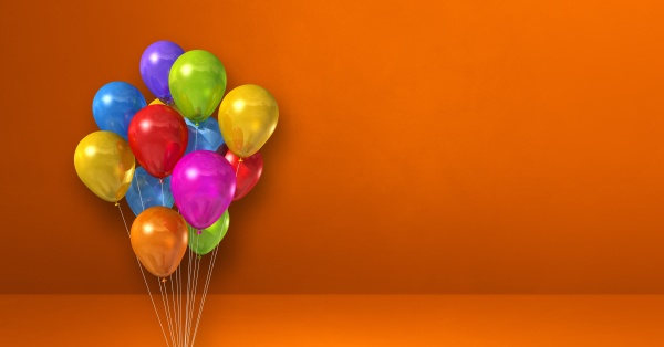 colorful balloons bunch on orange wall