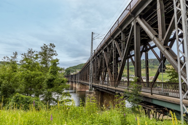 old iron bridge spans river moselle