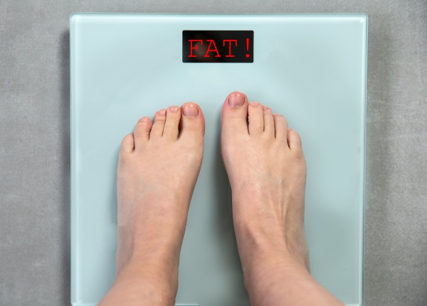 feet on digital weight scale with