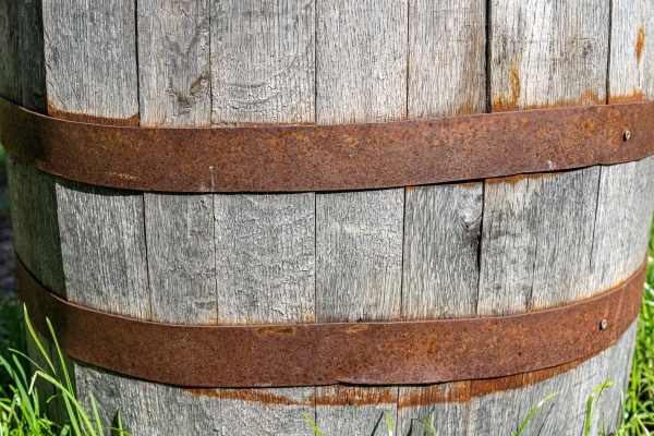 big wooden wine cask with rusted