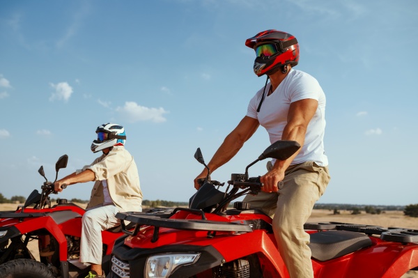 men in helmets and glasses ride