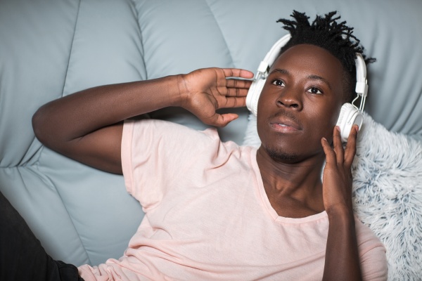 african american man in headphones listening