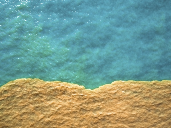 aerial view of clear water meeting