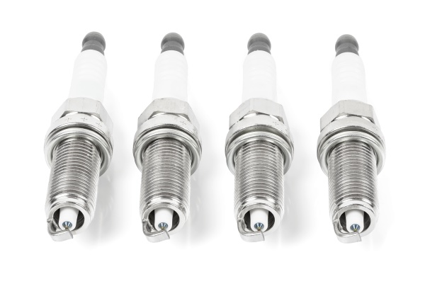 four iridium spark plugs in a