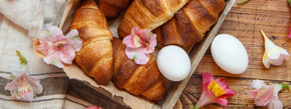 fresh croissants eggs and flowers