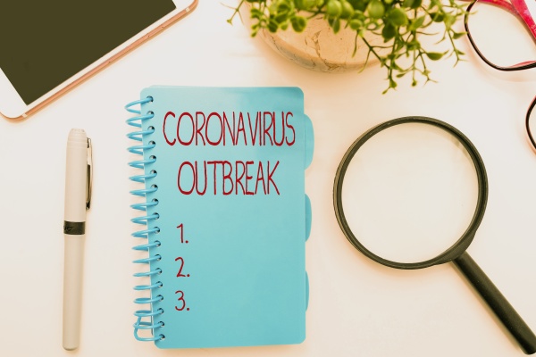hand writing sign coronavirus outbreak
