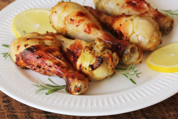 grilled chicken legs with mustard on