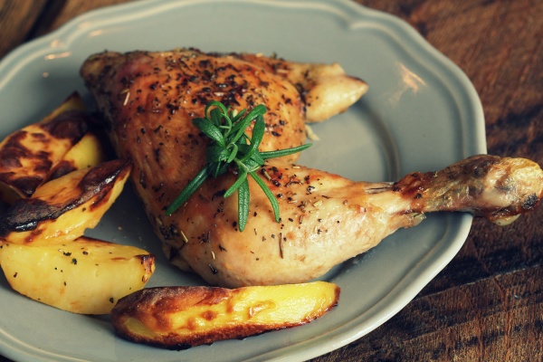 grilled chicken quarter with potato for