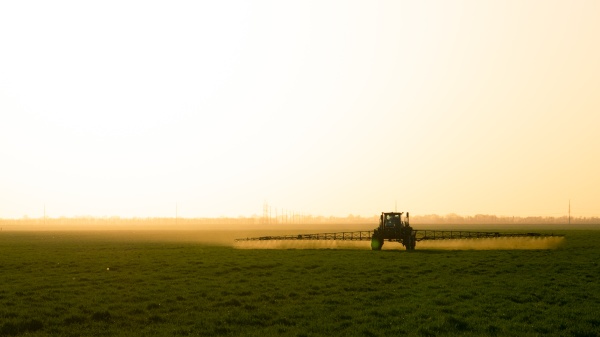 tractor on the sunset background