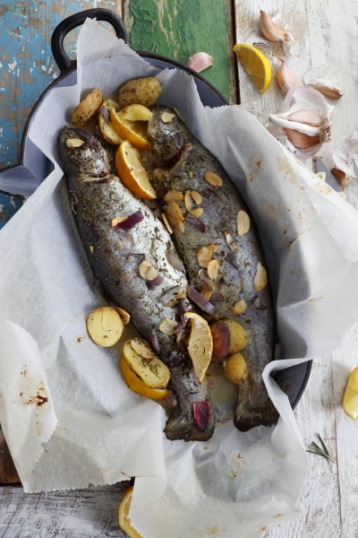 baked trout with pieces of potatoes