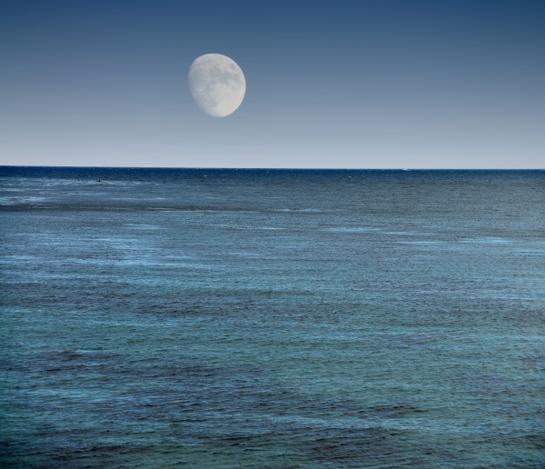 moon setting over pacific ocean california