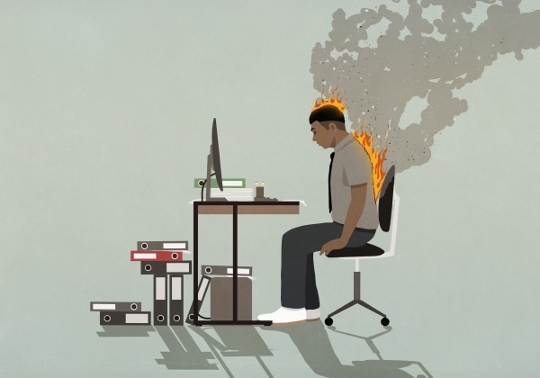 businessman on fire working at computer