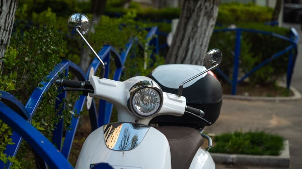 white smart rental electric motorcycle