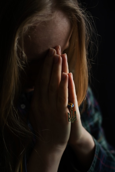 woman praying god save ukraine