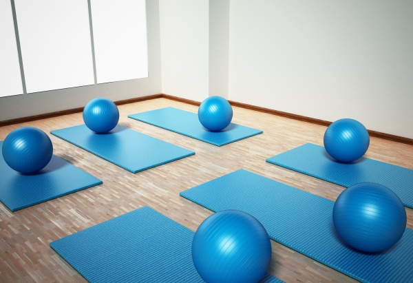 pilates mat and exercise balls standing