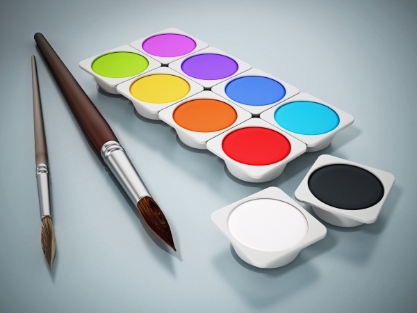 watercolor paints and paintbrushes isolated on