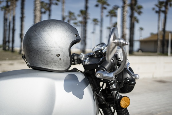 silver helmet on motorcycle during sunny
