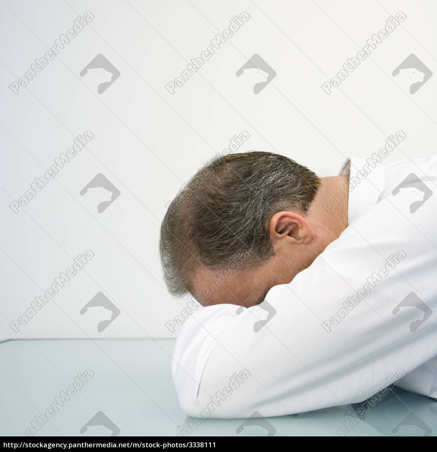 Businessman With Head On Desk Stock Photo 3338111