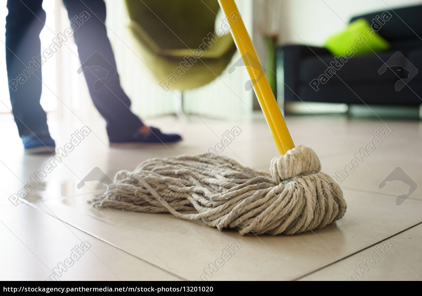 Woman Doing Chores Cleaning Floor At Home Focus On Mop Royalty