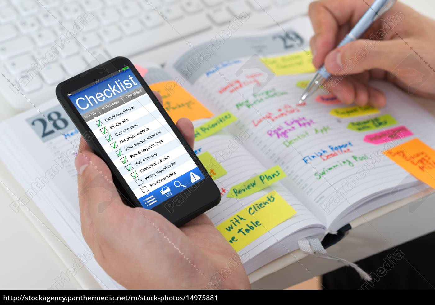 Person Checking List From Mobile Phone And Diary - Stock Photo ...