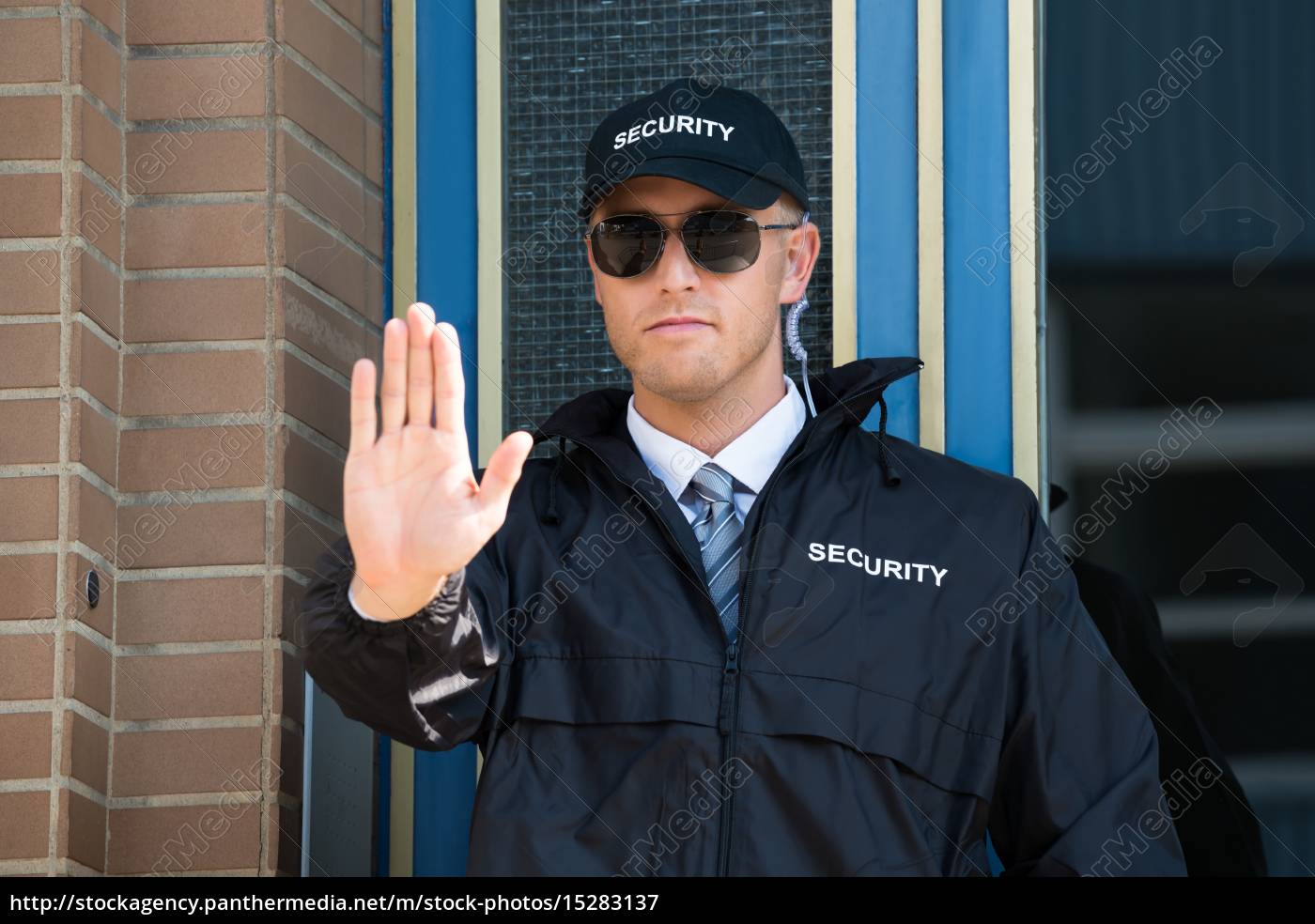 Male Security Guard Making Stop Sign With Hand - Royalty free image ...