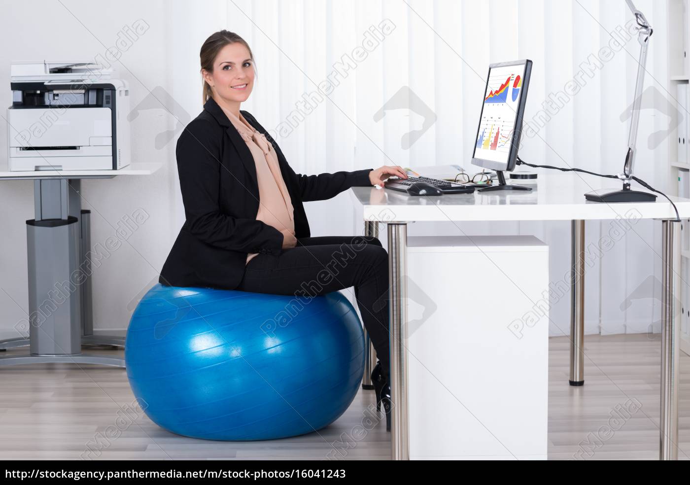 sitting on fitness ball