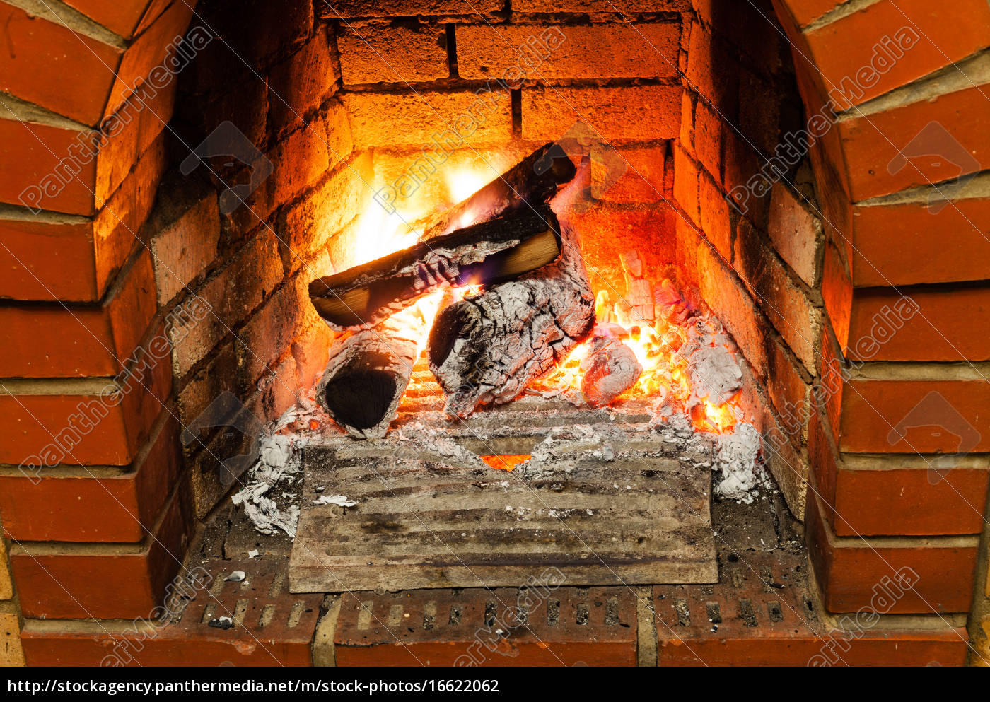 Ash Coal And Burning Firewood In Fireplace Stock Image