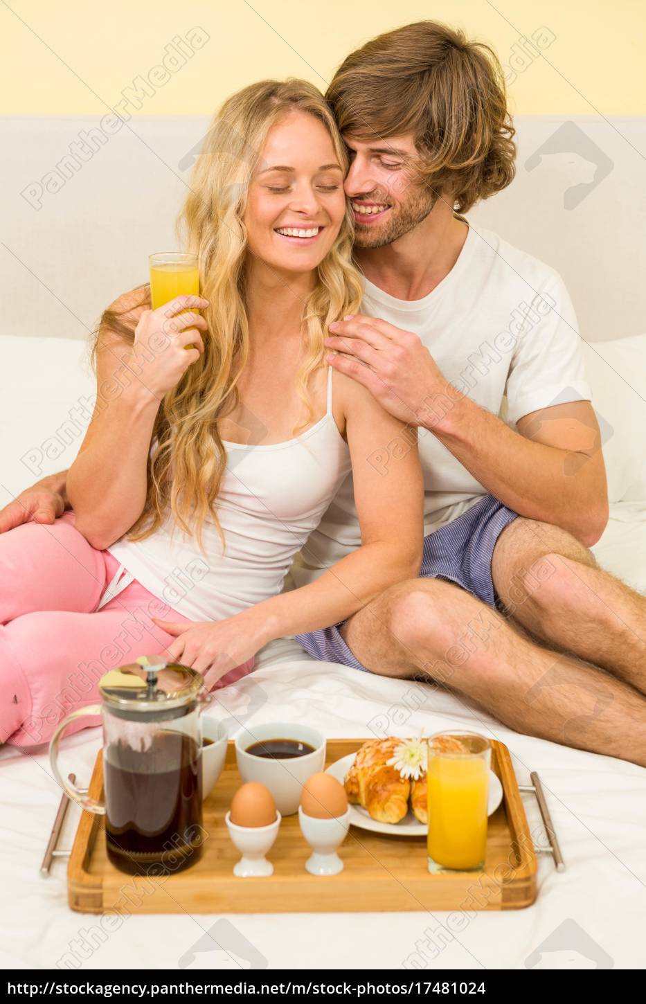 Royalty Free Photo 17481024 Cute Couple Having Breakfast Sitting On Their Bed