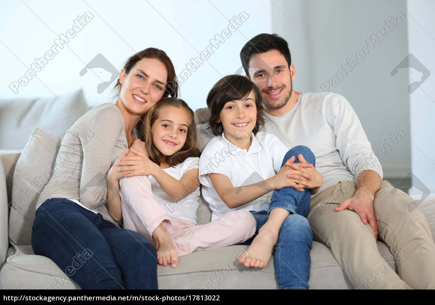 Happy Family Sitting Together In Couch Royalty Free Image Panthermedia Stock Agency