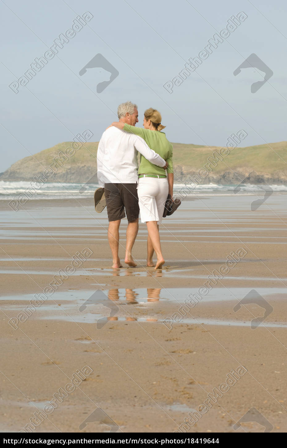 Couple Walking Arm In Arm On A Beach Royalty Free Photo Panthermedia Stock Agency