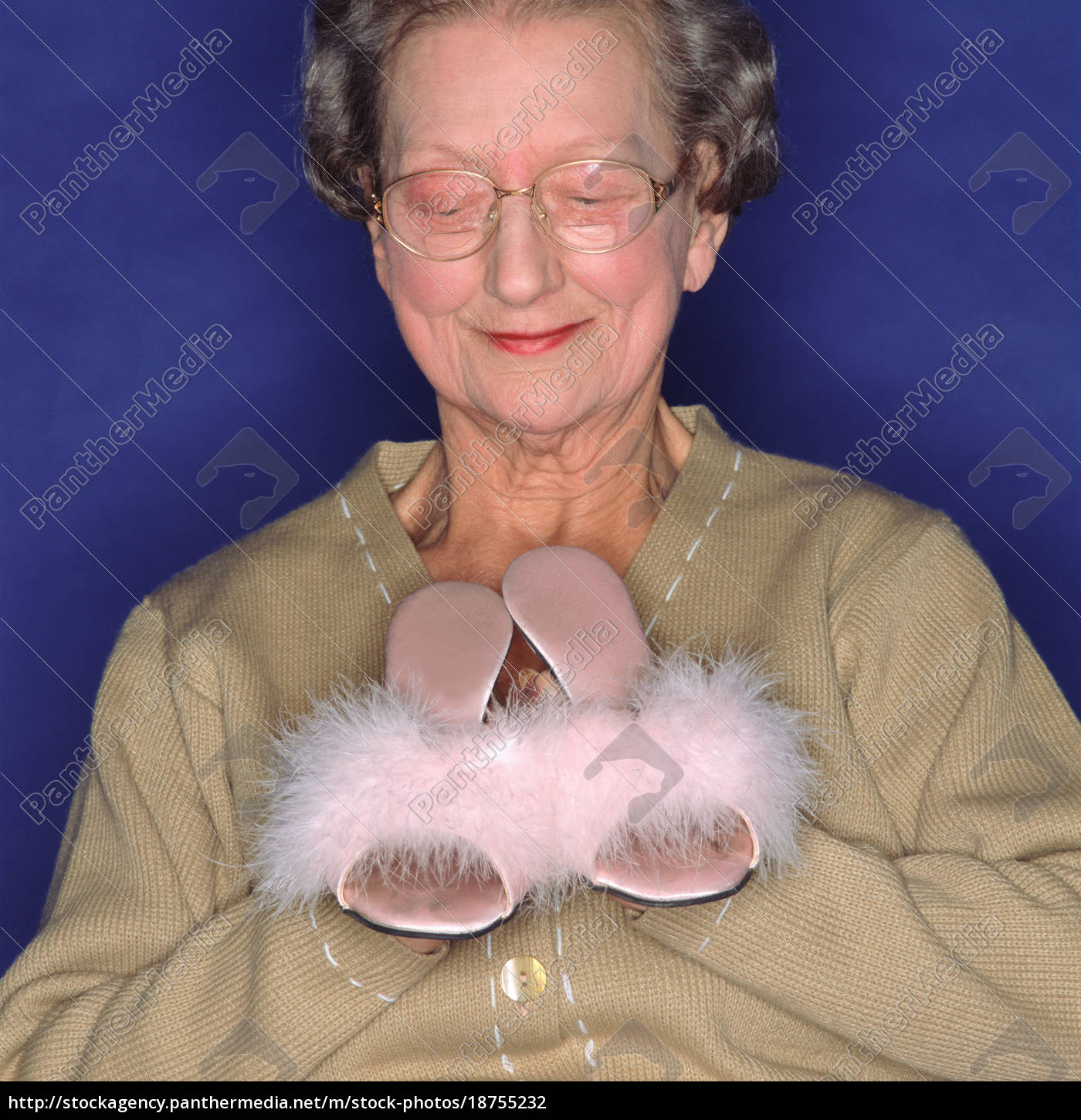 Senior woman holding sexy slippers - Royalty free - | PantherMedia Stock Agency