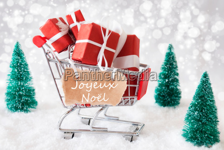 Trolly With Gifts Joyeux Noel Means Merry Christmas - Stock Photo