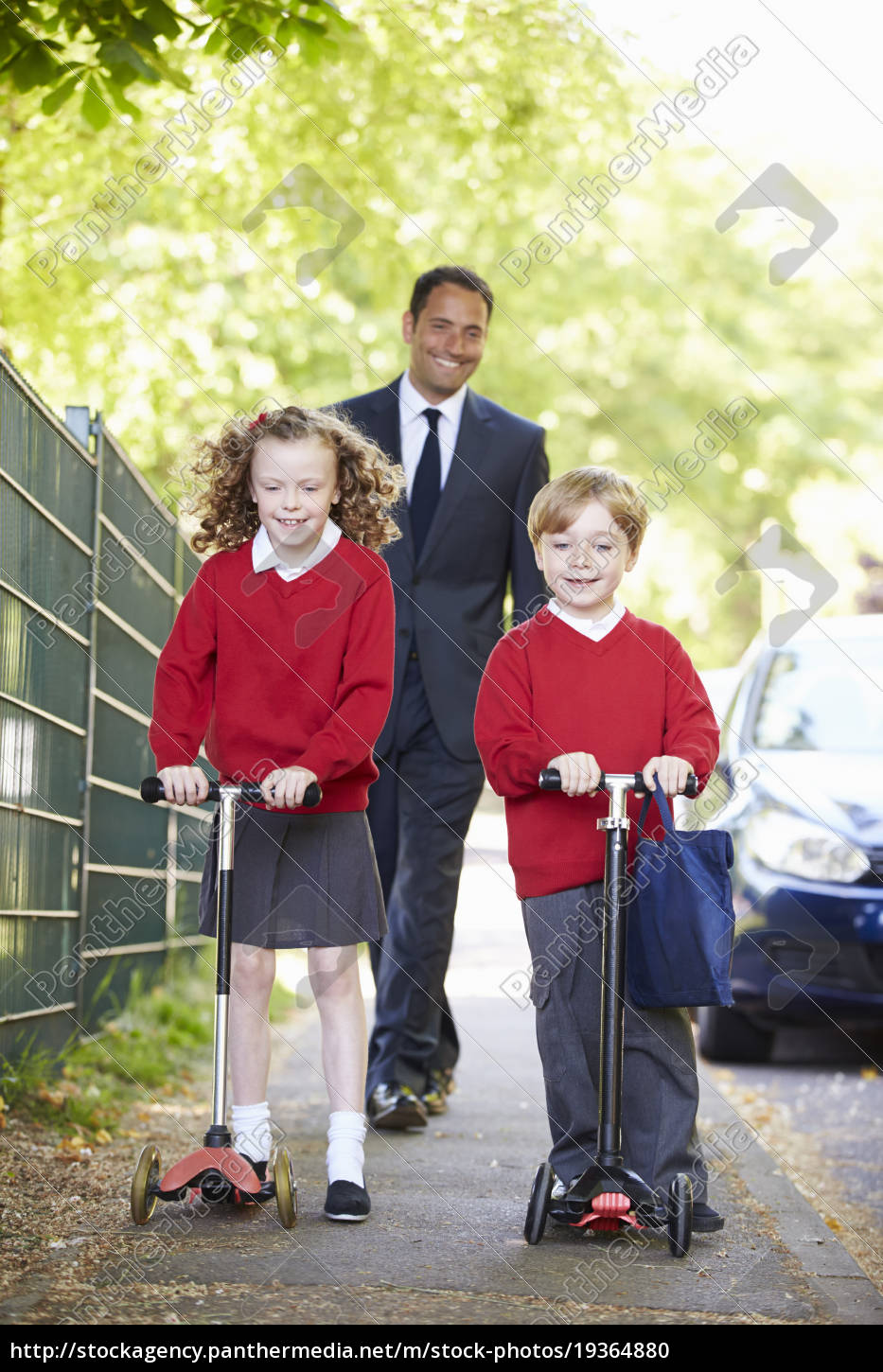 child riding scooter