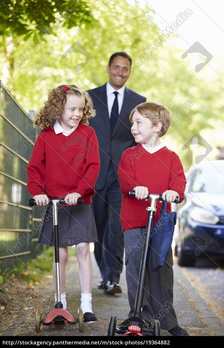 child riding scooter