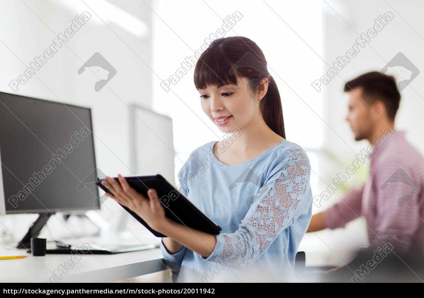 Happy Creative Female Office Worker With Tablet Pc Stock Image Panthermedia Stock Agency