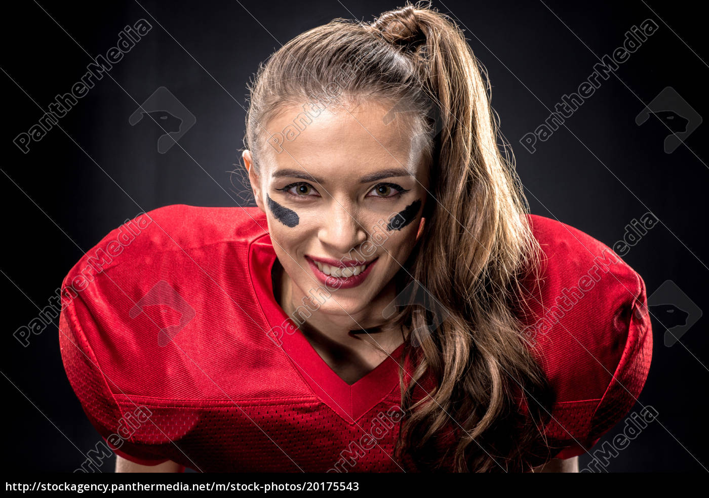 Female american football player in uniform, Stock image