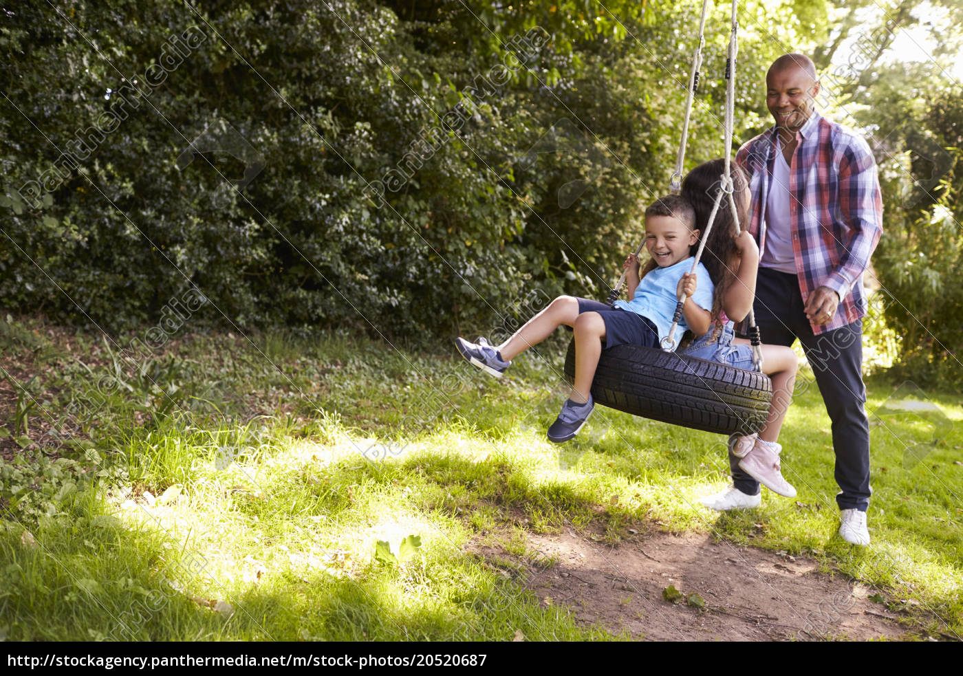 Royalty Free Image 20520687 Father Pushing Children On Tire Swing In Garden