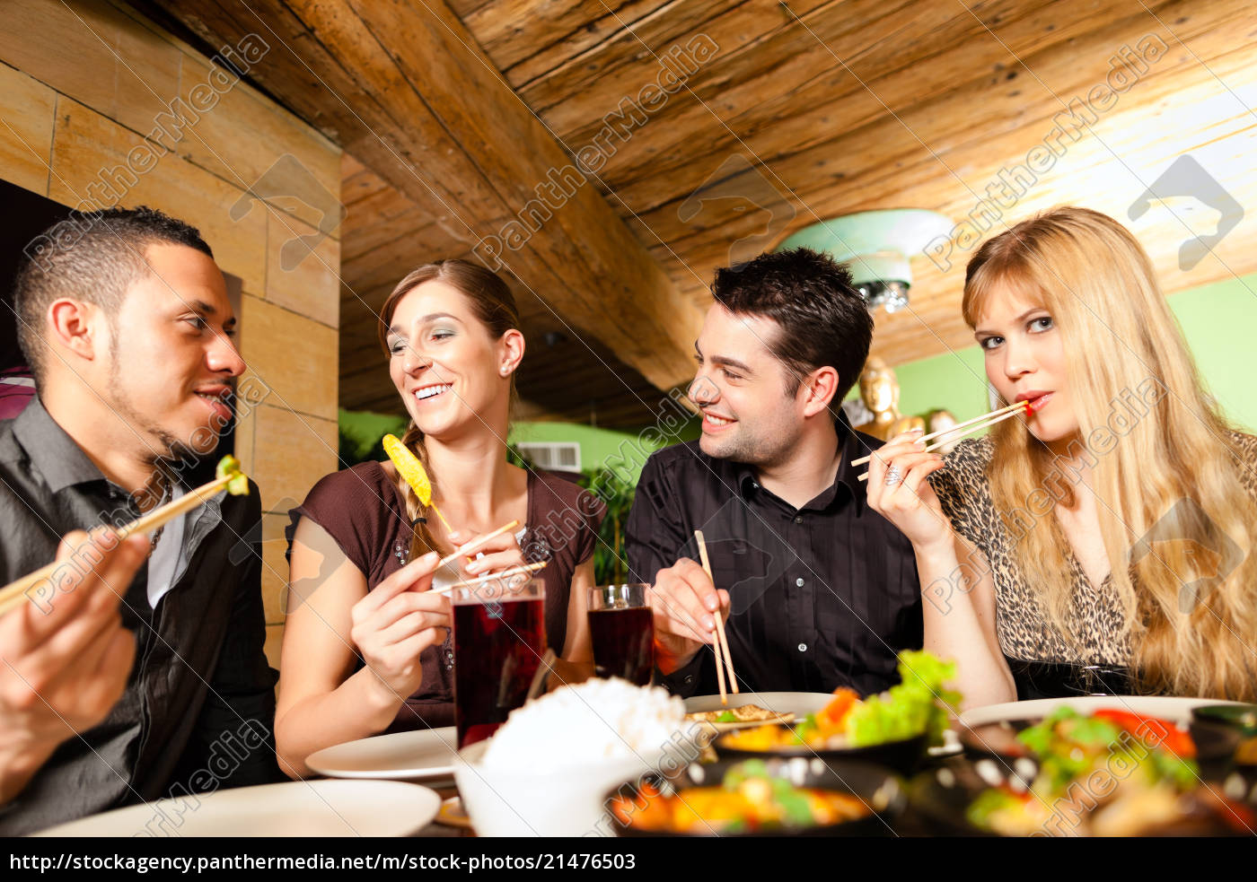 people eating with chopsticks