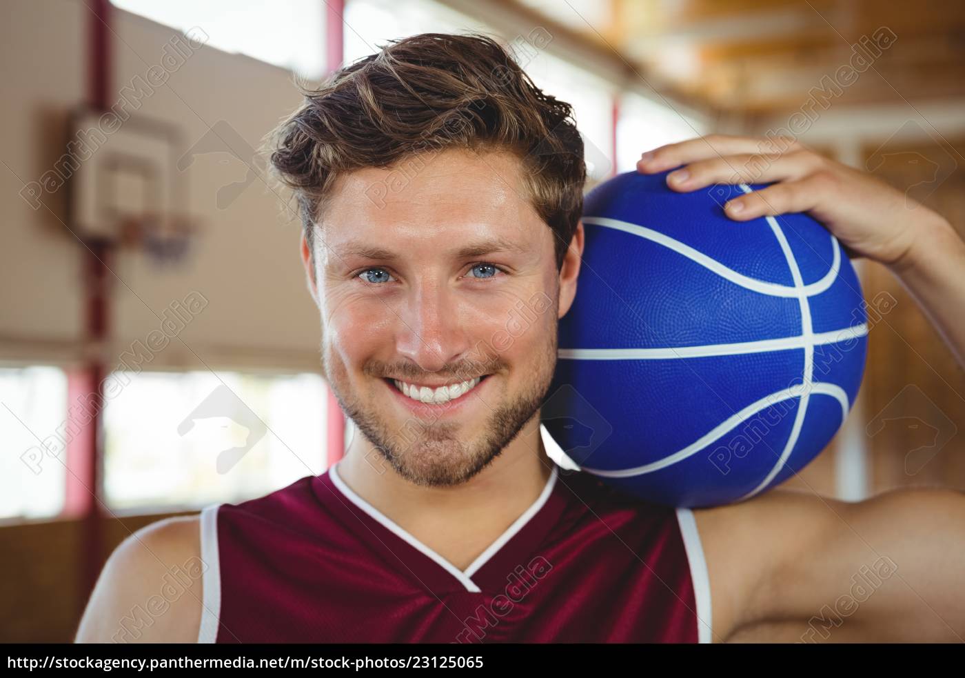 Close Up Portrait Of Smiling Basketball Player Holding Royalty Free Image Panthermedia Stock Agency